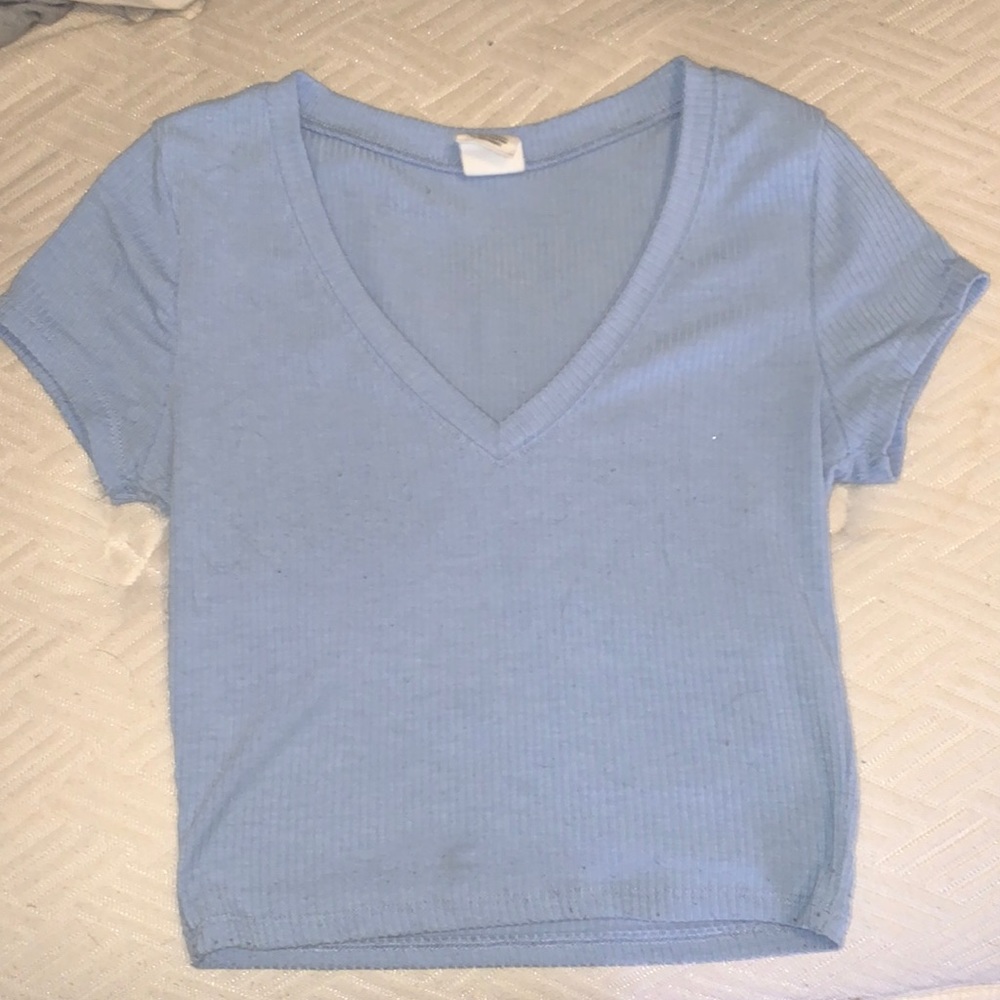 this is a cute, blue, v-neck shirt. Very comfortable and soft to wear.